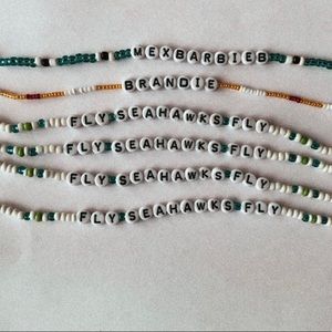 Six beaded bracelets.